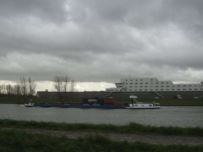 Barge and cruise ship on canal