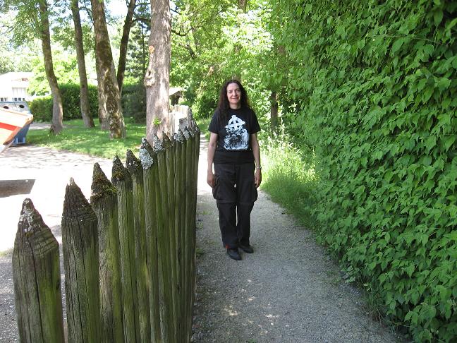 Cindy on pathway behind houses