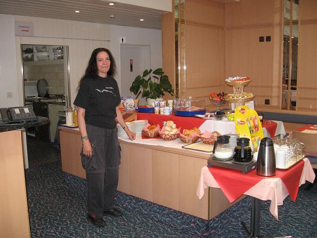 Cindy in front of breakfast spread