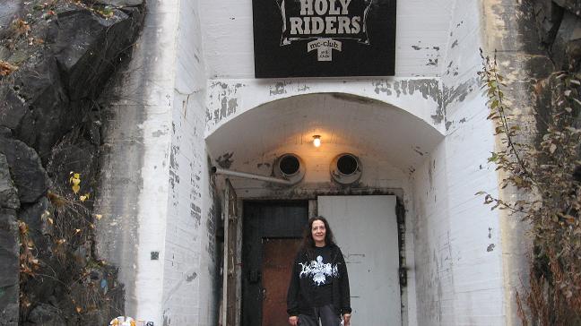 Cindy in front of entrance to cave