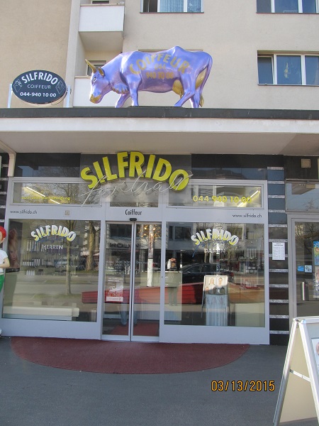 Hair salon with cow (symbol of Switzerland) on top